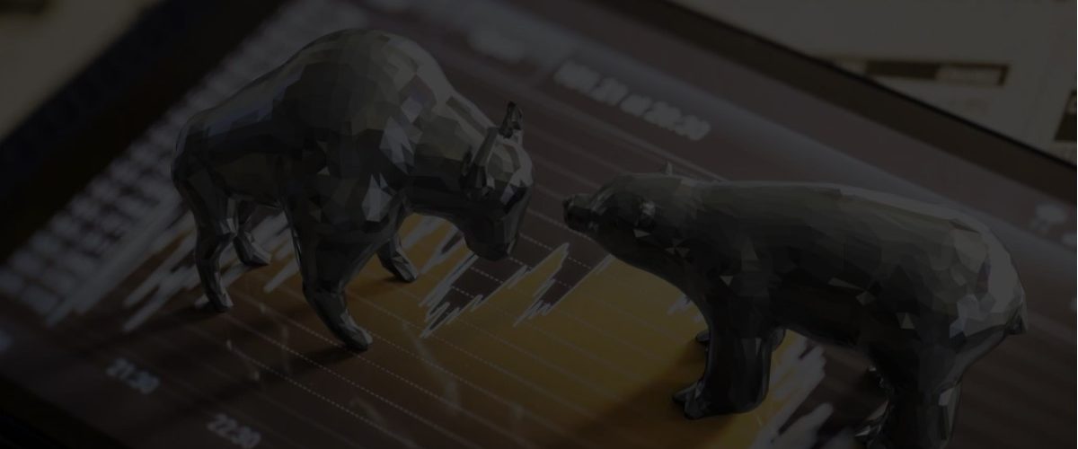 2 touros em alusão a bolsa de valores em cima de uma mapa